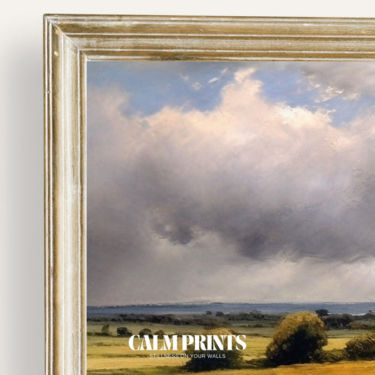Print of a serene rural landscape with rolling fields beneath calm clouds