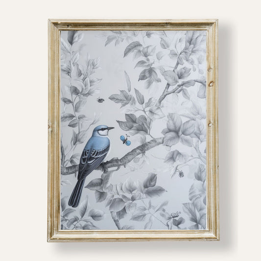 Charming blue bird perched quietly among lush green leaves
