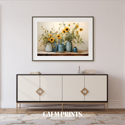 Bright yellow sunflowers displayed in richly coloured blue vessels
