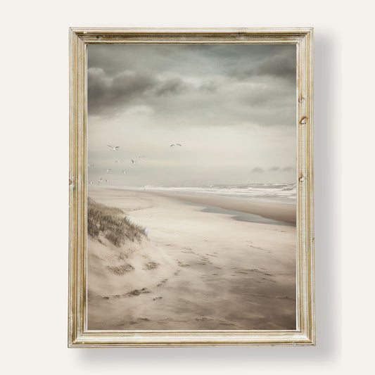 Tranquil beach scene with soaring seagulls under a soft coastal sky
