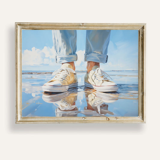 Casual sneakers resting on a reflective summer beach in golden light
