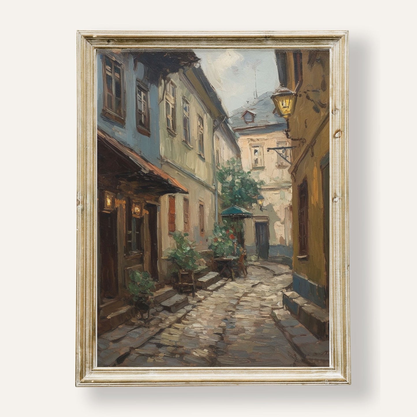 Charming cobblestone street winding through a quaint and peaceful town
