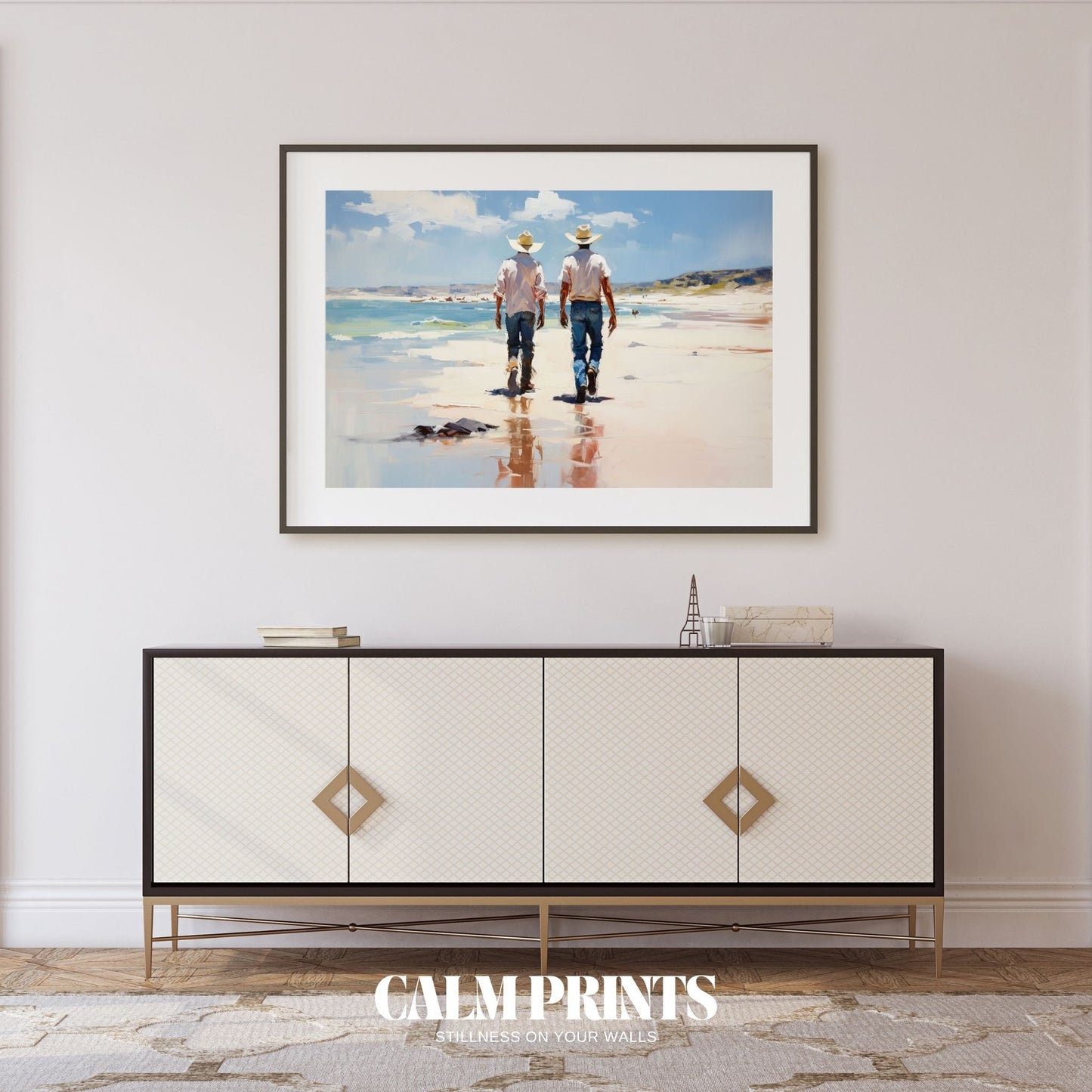 Artwork of cowboys walking the beach at sunset with horses and shadows
