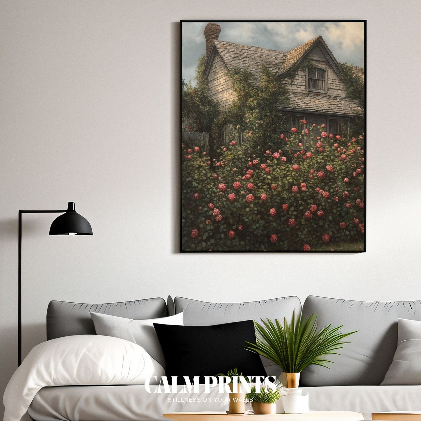 Classic English garden scene with a cottage framed in rose bushes

