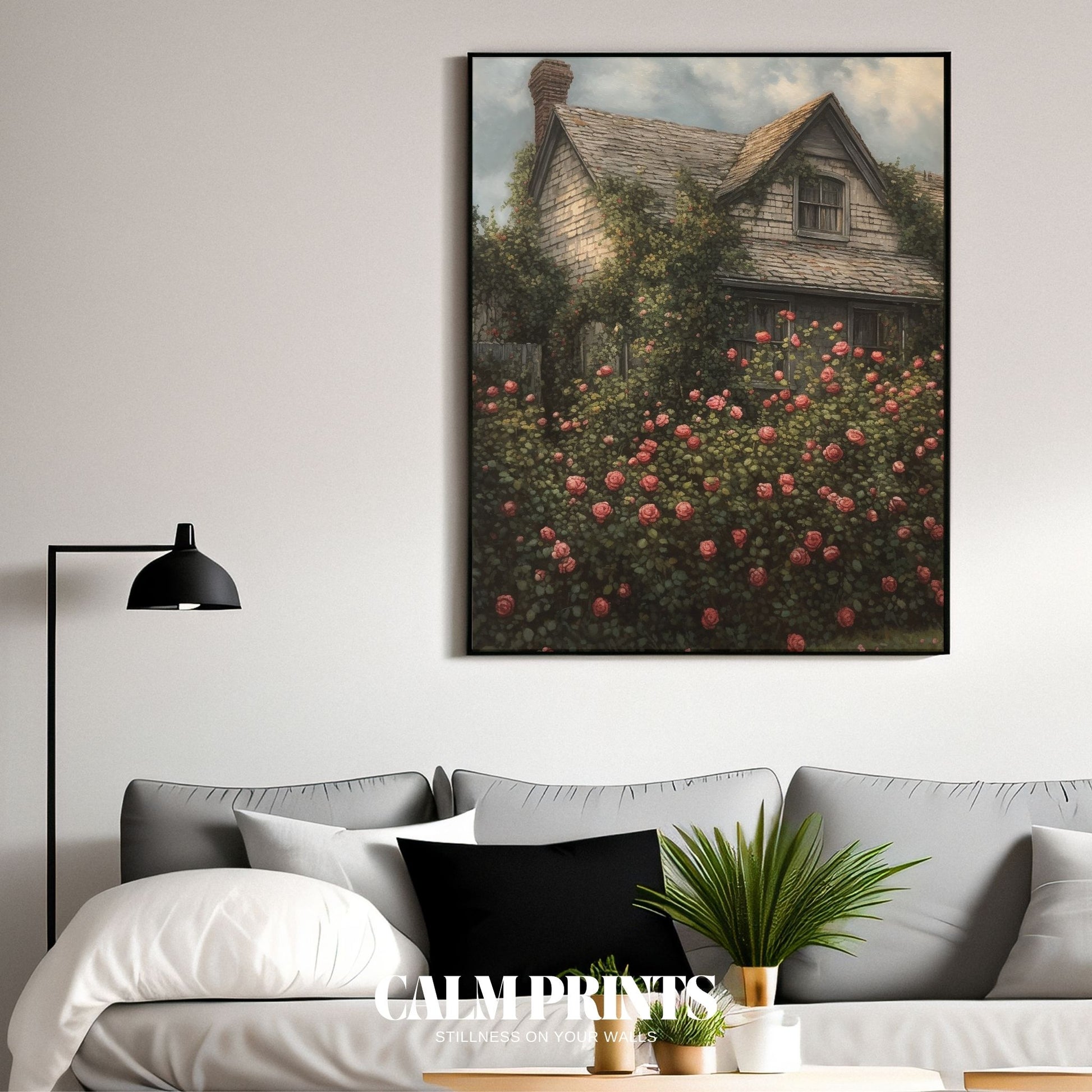 Classic English garden scene with a cottage framed in rose bushes
