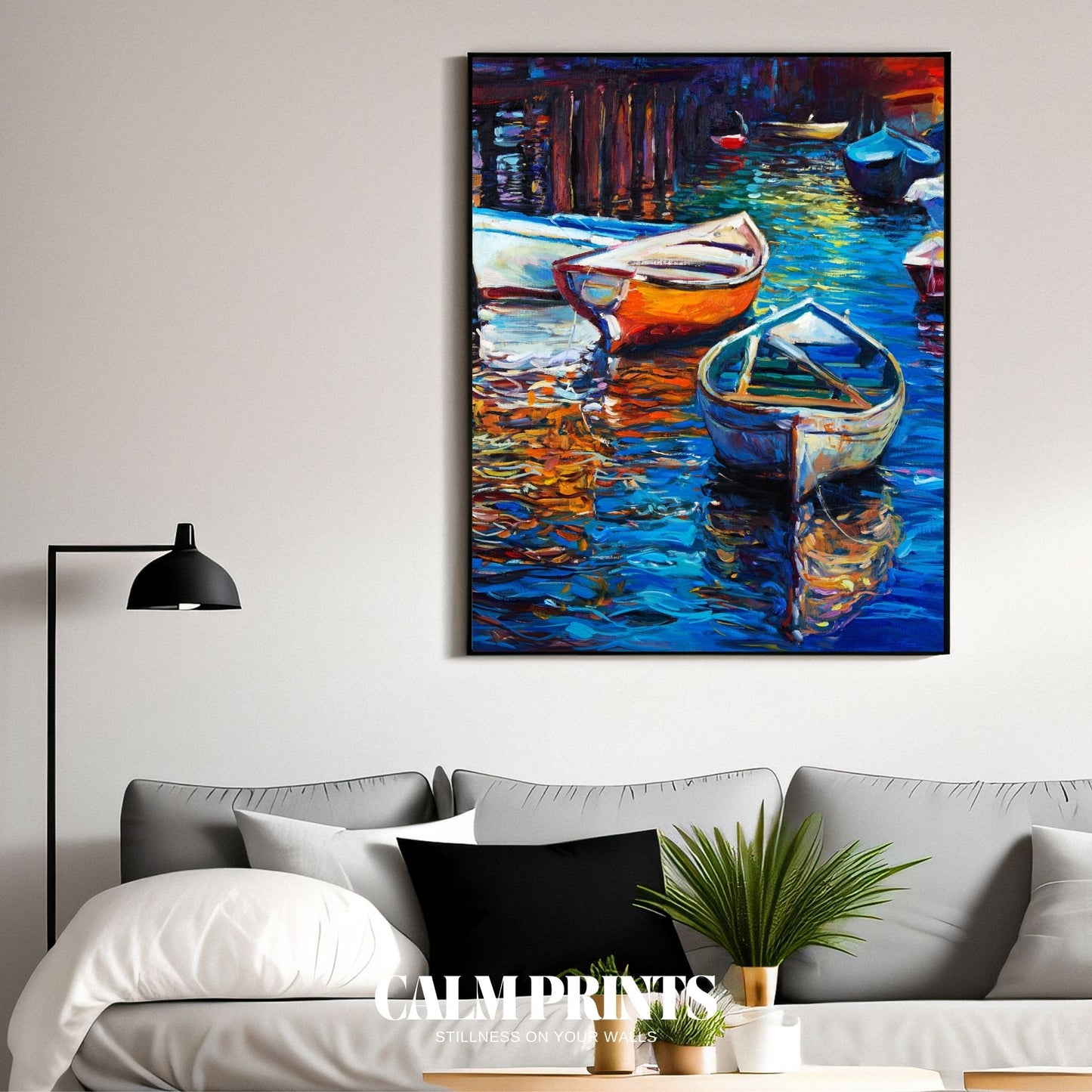 Evening scene of colourful boats reflecting warm sunset hues on calm water
