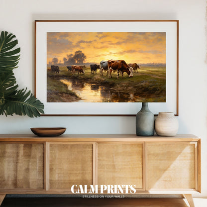 Poster of cows resting beside a gentle river under warm evening light
