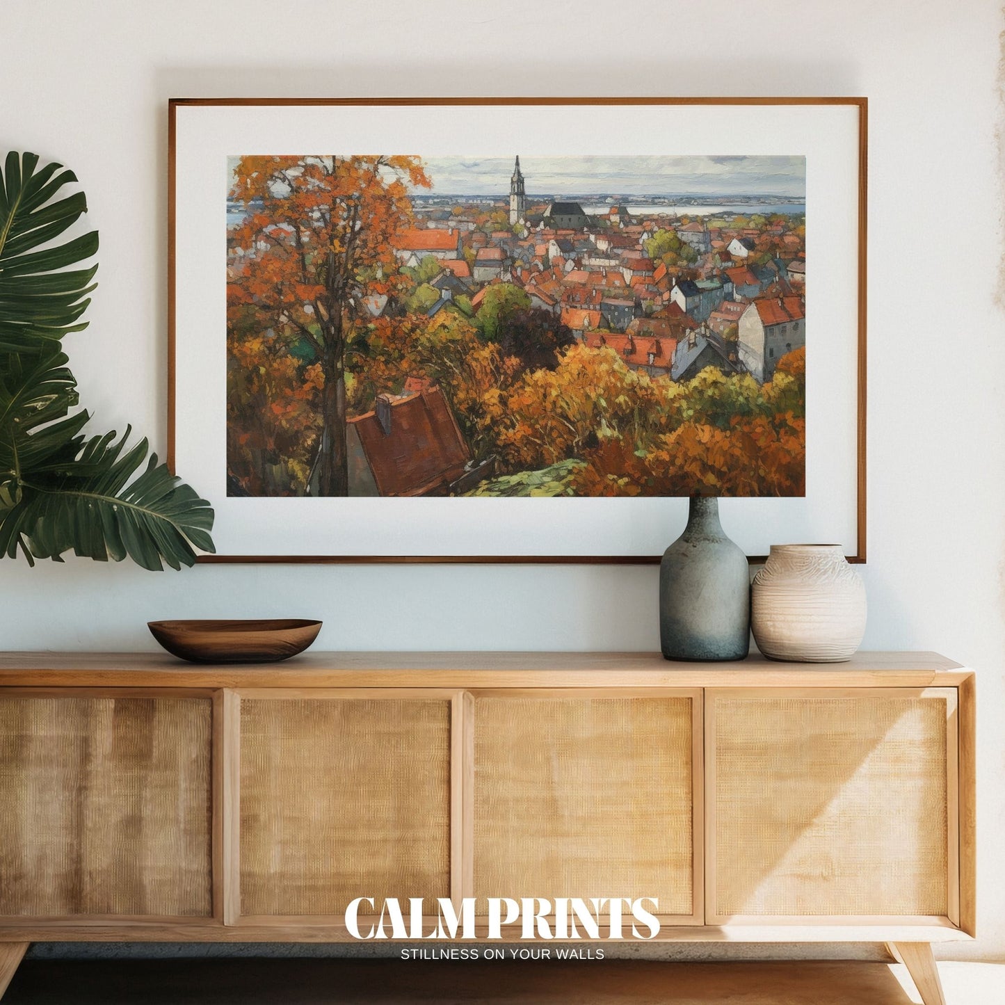 Historic town bathed in gentle autumn light and falling leaves
