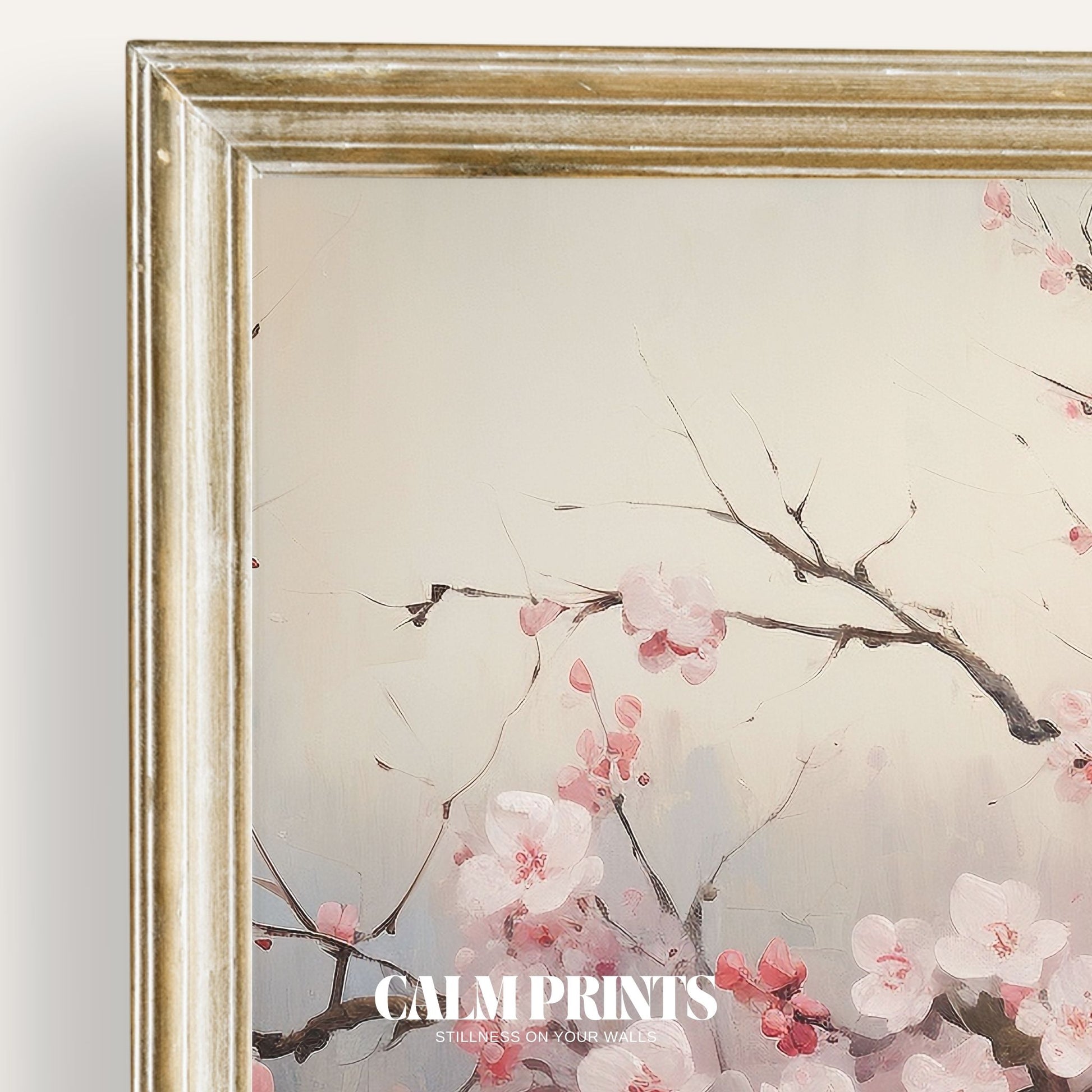 Print of soft pink cherry blossoms hanging gracefully over still water

