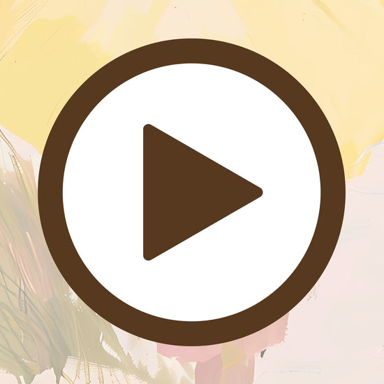 Seaside scene filled with golden light and a cheerful yellow umbrella