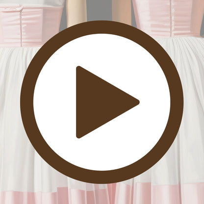 Synchronised ballet dancers in fluid motion under soft lighting