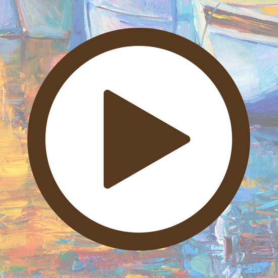 Sunlit boats gently floating with their reflections on a calm harbour surface

