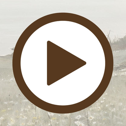 Peaceful view of a grassland meeting the sea in soft, natural tones