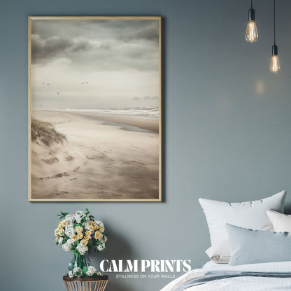 Serene poster of a seagull in flight over a quiet beach landscape
