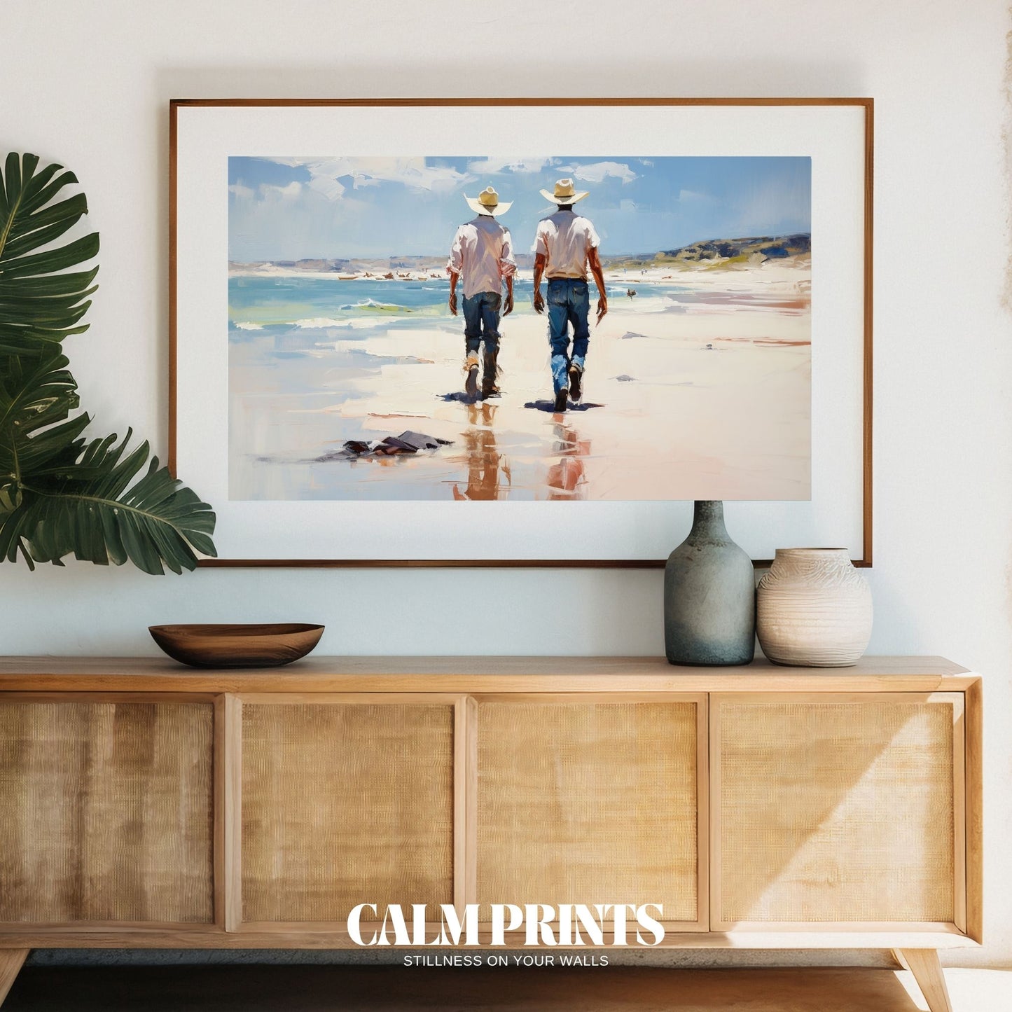Silhouetted cowboys strolling peacefully along a reflective shoreline
