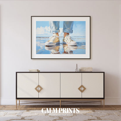 Sneakers mirrored in the shallow tide along a calm summer shoreline
