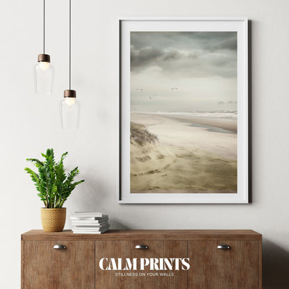 Soft seaside sky with graceful seagulls drifting above the water
